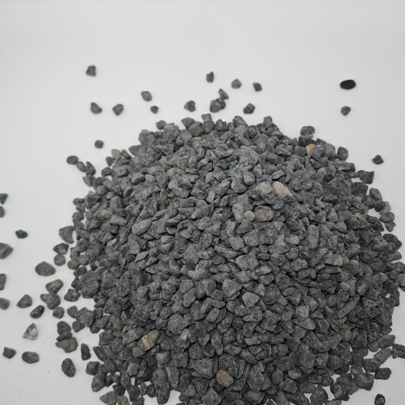 Black small pebbles stockpile showing fine grading