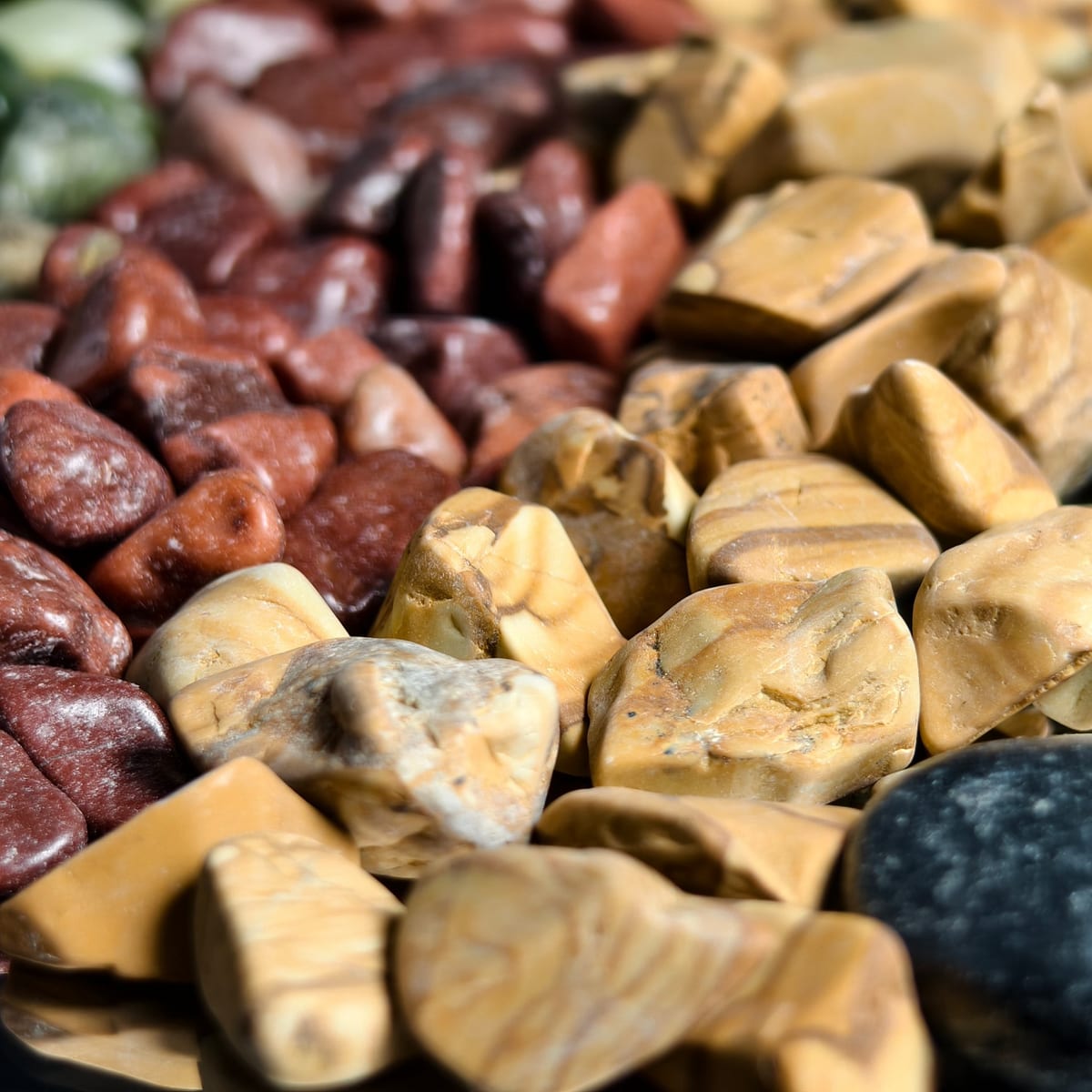 Tan landscape gravel stockpiled for wholesale supply