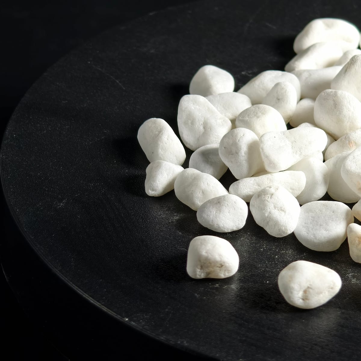 White landscaping pebbles stockpiled for wholesale supply